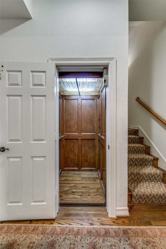 interior space with hardwood / wood-style floors