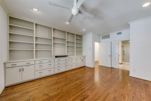 unfurnished bedroom featuring ceiling fan, crown molding, and light hardwood / wood-style flooring