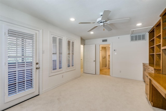 unfurnished bedroom featuring ceiling fan, light colored carpet, and access to exterior