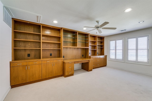 unfurnished office with light carpet and ceiling fan