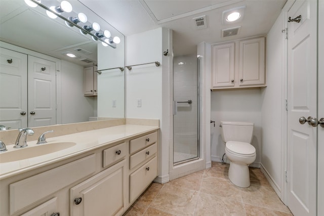 bathroom featuring vanity, toilet, and an enclosed shower