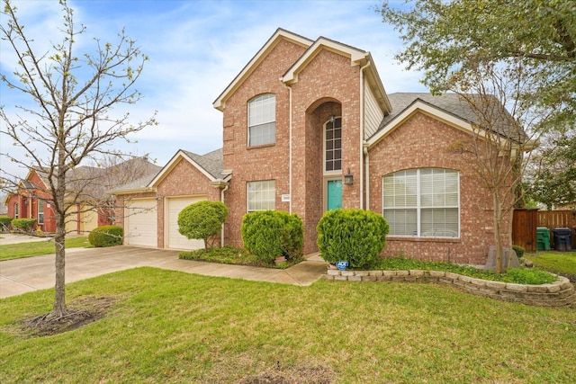 front of property featuring a front lawn and a garage