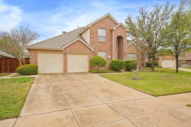 front of property featuring a garage and a front lawn