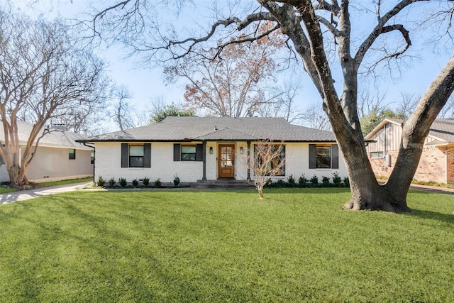 ranch-style house featuring a front lawn