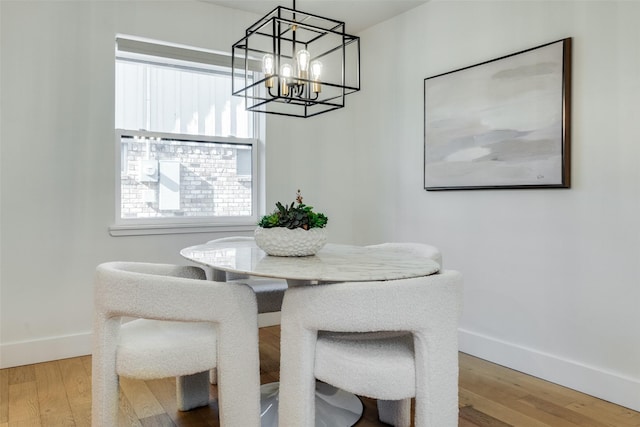 dining area with a chandelier and hardwood / wood-style floors