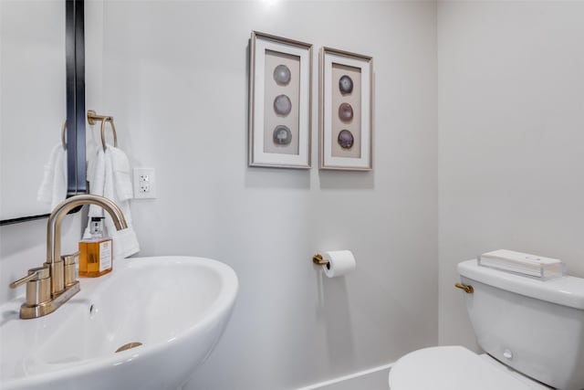 bathroom with sink and toilet