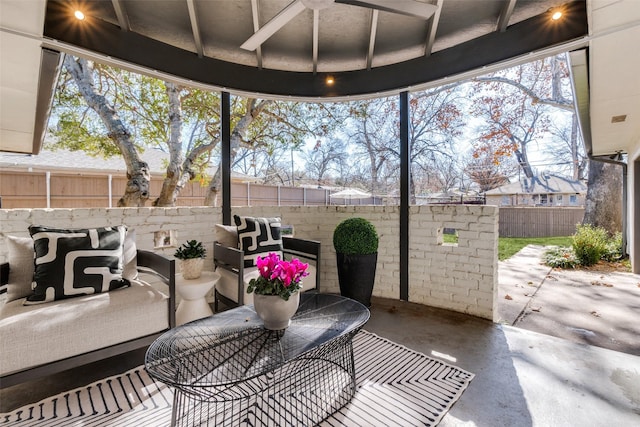 view of patio / terrace featuring ceiling fan, a grill, and outdoor lounge area