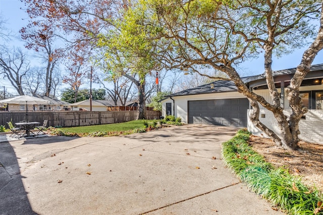 view of side of property featuring a garage