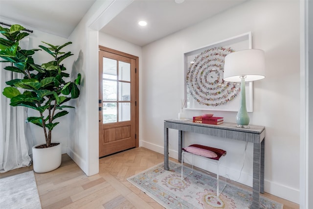 foyer entrance featuring light parquet flooring