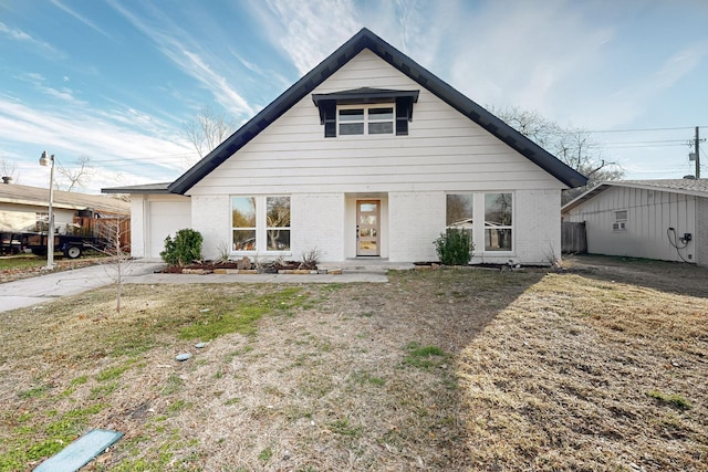 view of front facade with a front yard and a garage