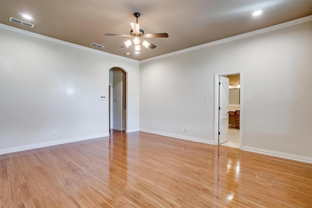 empty room with light hardwood / wood-style flooring and ornamental molding