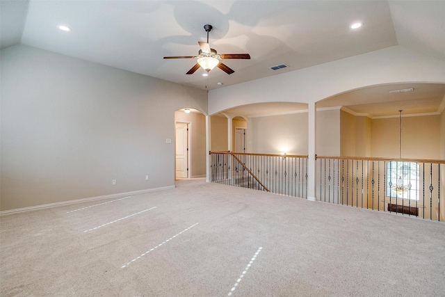 unfurnished room featuring ceiling fan, crown molding, carpet floors, and lofted ceiling