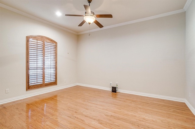 spare room with ceiling fan, light wood-type flooring, and ornamental molding