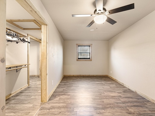 bonus room featuring ceiling fan and wood-type flooring