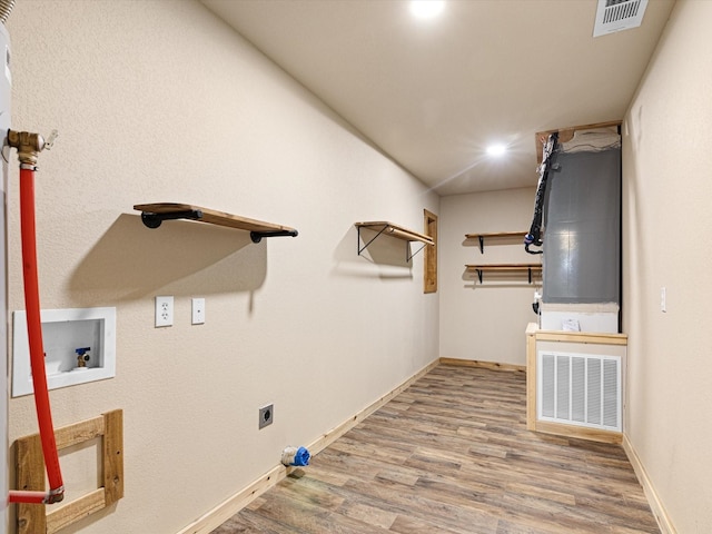 laundry room featuring washer hookup, laundry area, electric dryer hookup, visible vents, and wood finished floors