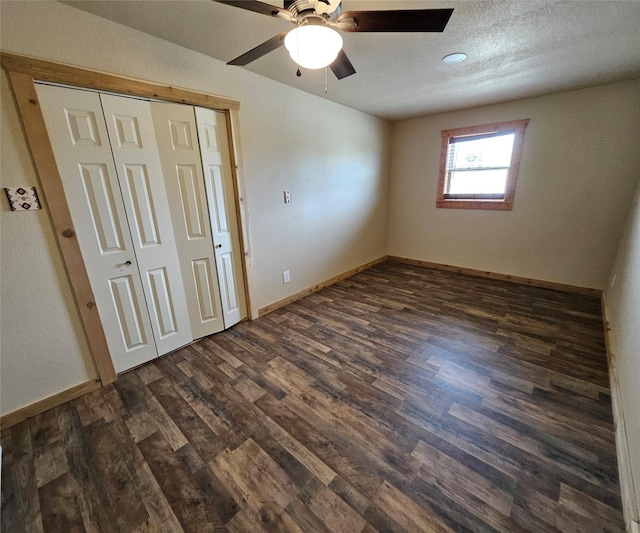 unfurnished bedroom with ceiling fan, baseboards, a closet, recessed lighting, and dark wood-type flooring