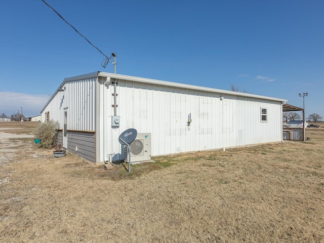 view of outbuilding featuring a yard