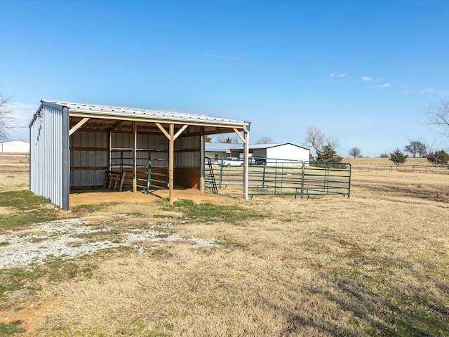 view of outbuilding featuring a rural view