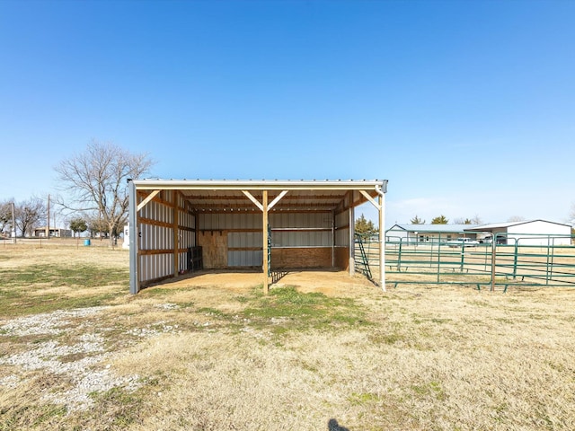 view of outbuilding featuring a rural view