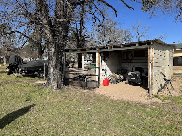 view of outdoor structure featuring a lawn