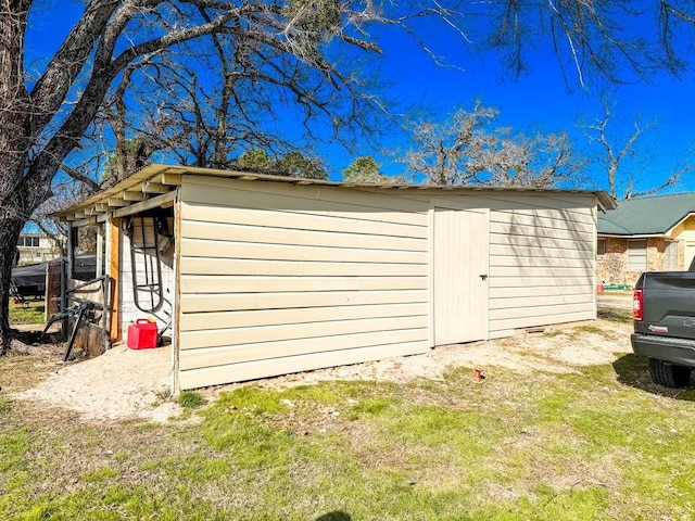 garage featuring a yard