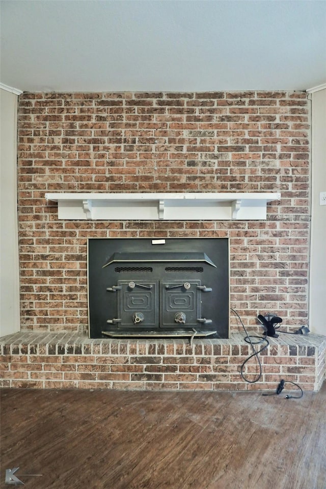 interior details featuring ornamental molding and hardwood / wood-style flooring