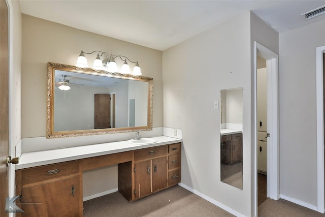 bathroom with ceiling fan and vanity