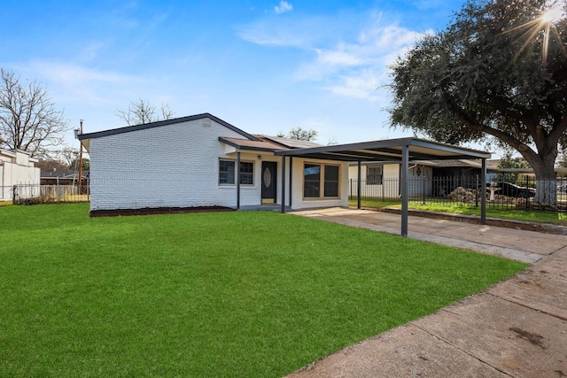 single story home featuring a front yard and a carport