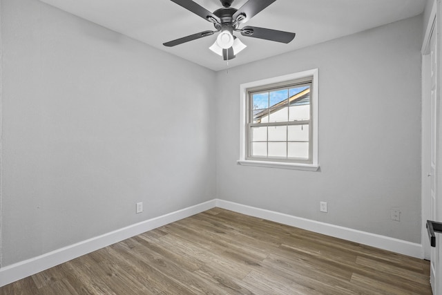 spare room featuring hardwood / wood-style flooring and ceiling fan