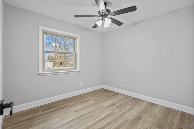 empty room featuring ceiling fan and light wood-type flooring