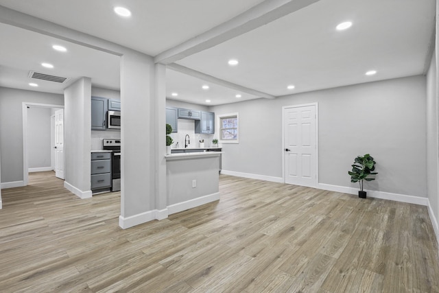 3832 Stateoak Dr, Dallas, TX 75241 - unfurnished living room with light wood-type flooring, a sink, recessed lighting, and baseboards