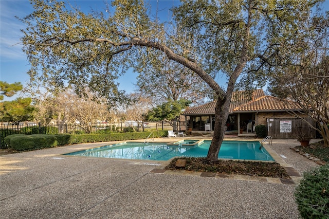 view of swimming pool featuring a patio area