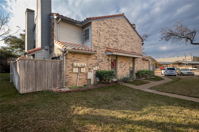 view of property exterior with a yard