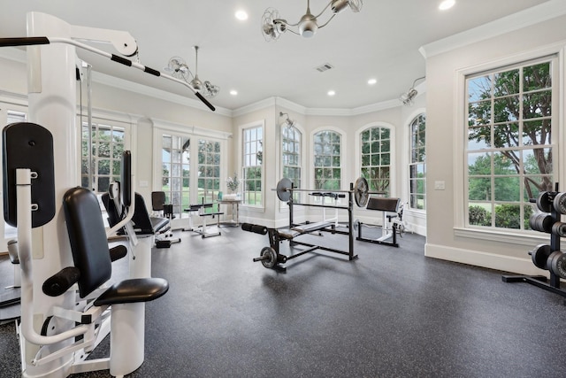 gym featuring crown molding, french doors, and an inviting chandelier