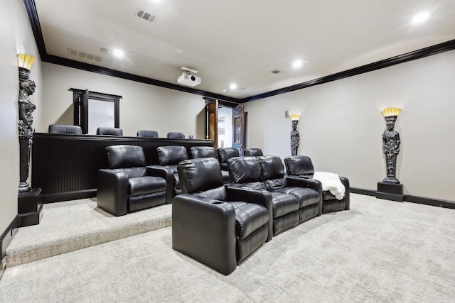 home theater featuring crown molding and light colored carpet