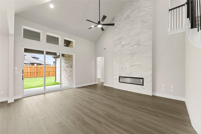 13728 Riola Dr, Little Elm, TX 75068 - unfurnished living room with high vaulted ceiling, a ceiling fan, wood finished floors, baseboards, and recessed lighting
