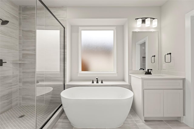 13728 Riola Dr, Little Elm, TX 75068 - bathroom with a stall shower, a soaking tub, and vanity