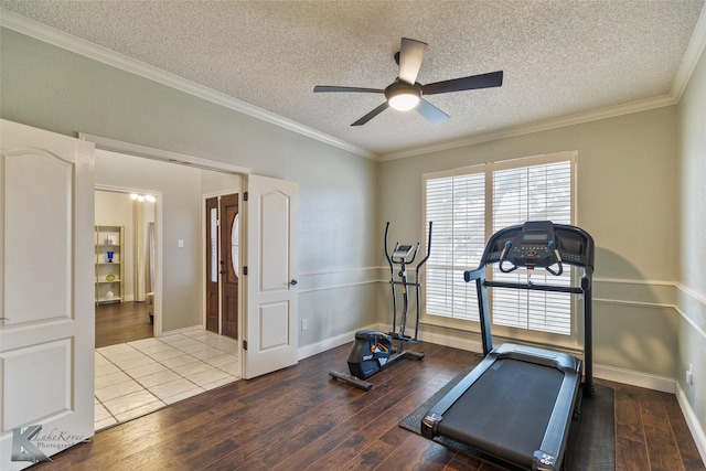 workout room with hardwood / wood-style flooring, a textured ceiling, and ceiling fan