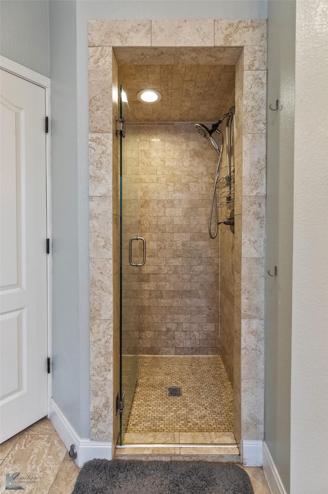 bathroom featuring an enclosed shower