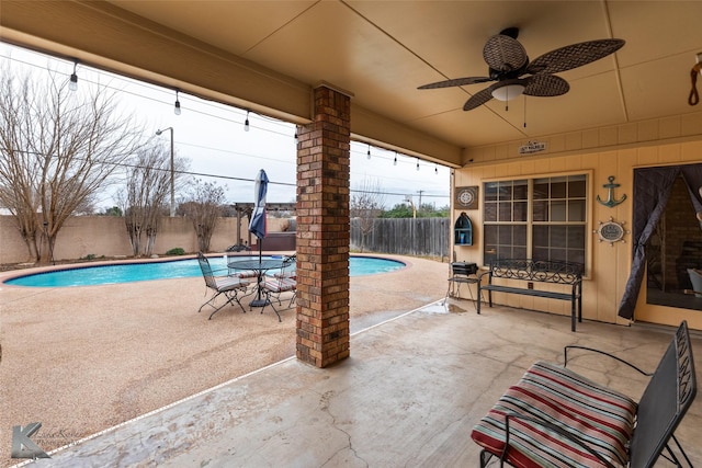 view of pool with ceiling fan and a patio area