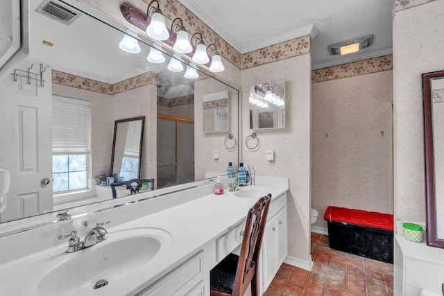 bathroom featuring toilet, vanity, and walk in shower