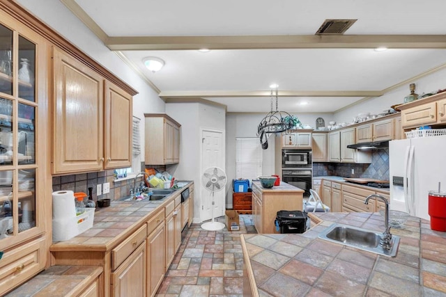 kitchen with tile countertops, appliances with stainless steel finishes, backsplash, a kitchen island, and sink