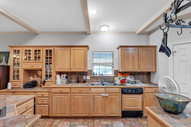 kitchen with decorative backsplash, dishwasher, sink, and tile countertops