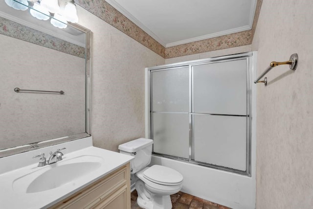 full bathroom featuring shower / bath combination with glass door, vanity, crown molding, and toilet