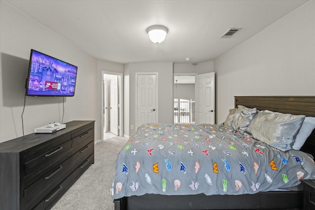 bedroom with light colored carpet