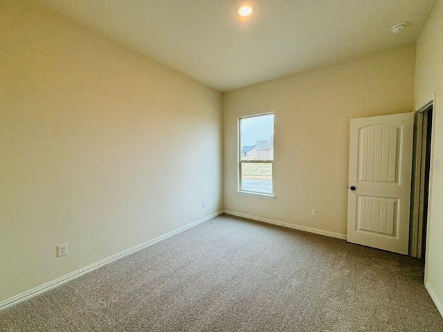 spare room featuring carpet