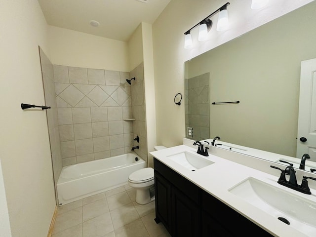 full bathroom with tiled shower / bath, vanity, toilet, and tile patterned flooring