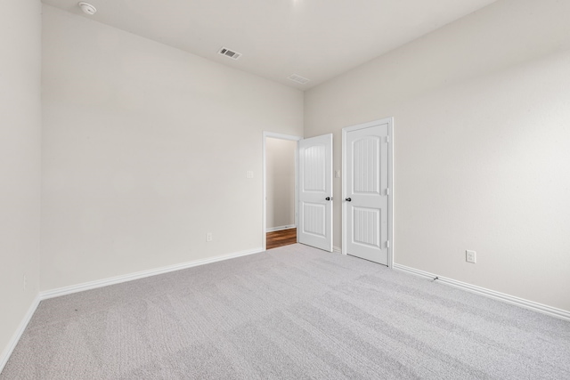 120 Roosevelt Ln, Valley View, TX 76272 - unfurnished bedroom with baseboards, carpet floors, and visible vents
