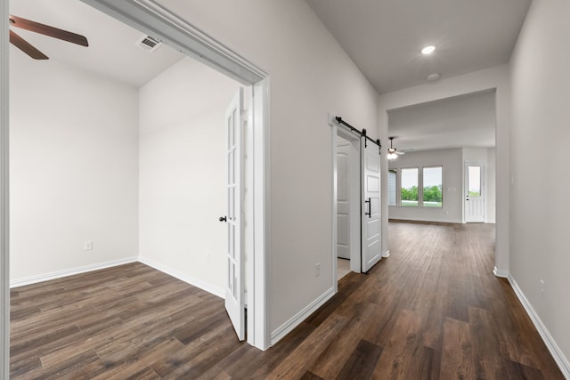 120 Roosevelt Ln, Valley View, TX 76272 - hall featuring baseboards, visible vents, dark wood-type flooring, and a barn door