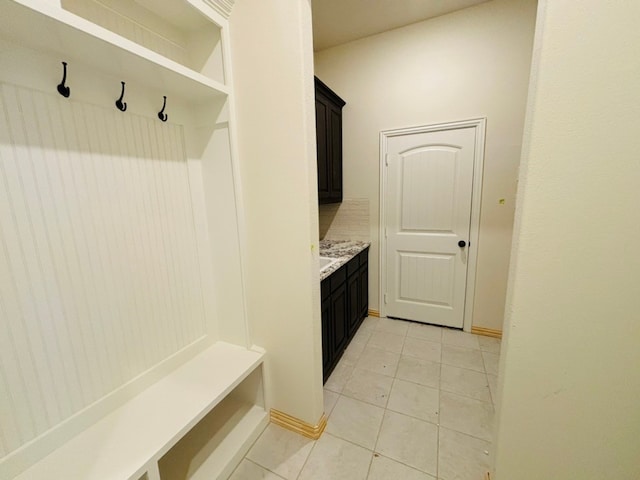 mudroom with light tile patterned floors